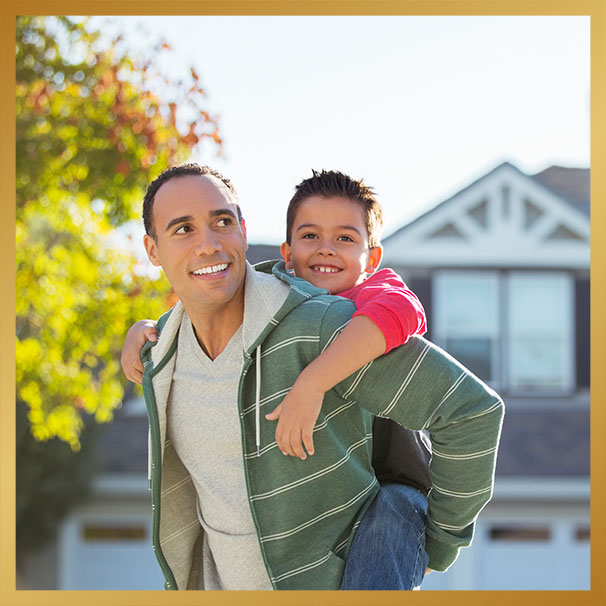 Father piggybacking son outdoors