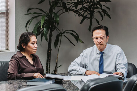 a man and a woman in a meeting room