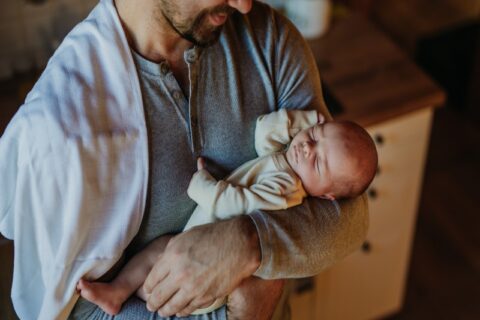 A Man Holding a Baby Represents Paternity and Legal Family Bonding in Tucson, AZ & Pima County
