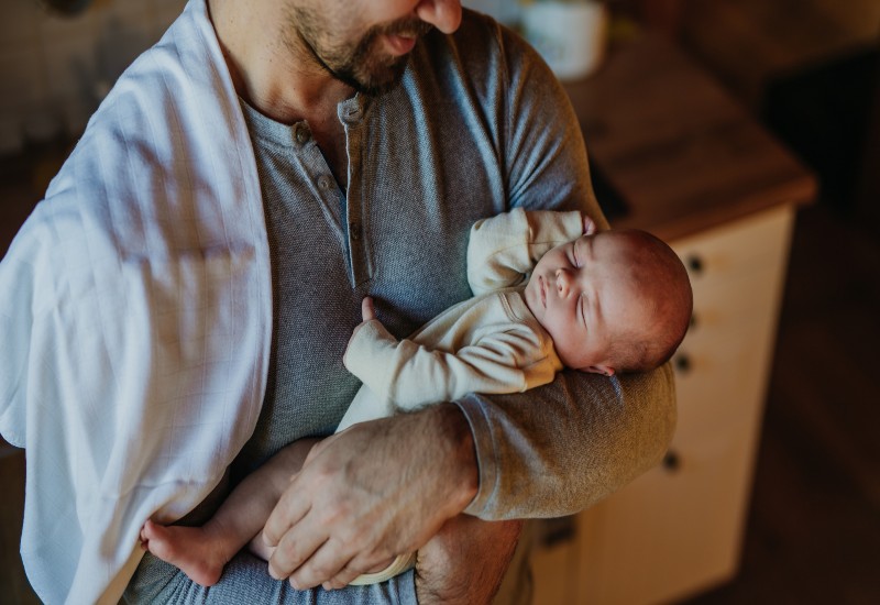 A Man Holding a Baby Represents Paternity and Legal Family Bonding in Tucson, AZ & Pima County
