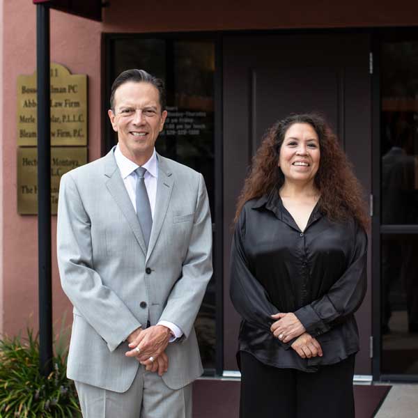Anita Hazlette &   Hector Montoya standing outside the office offering divorce law service in Tucson