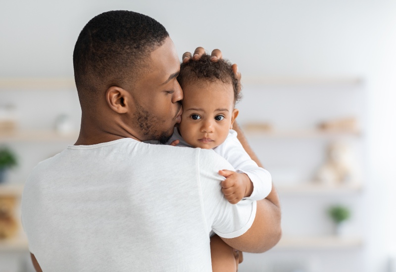 Parent Holding a Baby for Establishing Paternity in Tucson and Pima County, AZ